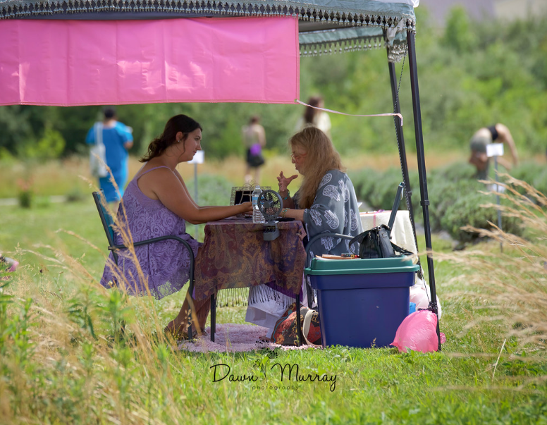 Outdoor wellness-style festival vendor setup