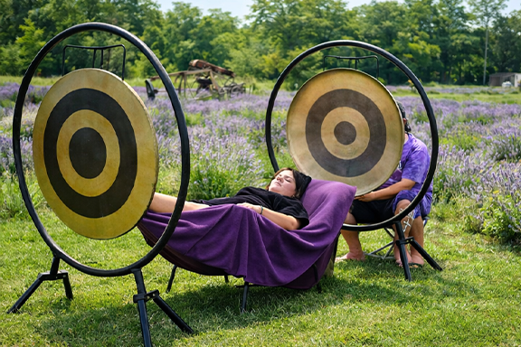 Sound healing gong meditation in the lavender field
